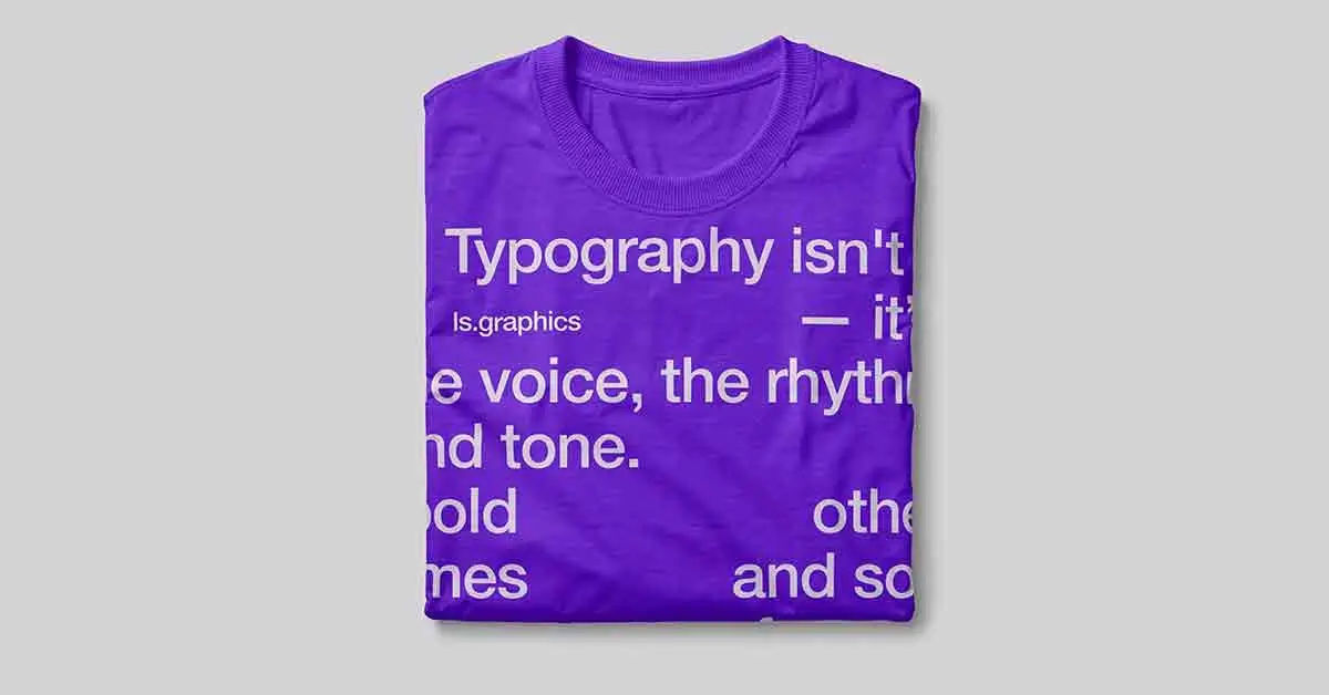 Folded purple t-shirt with abstract white typography design.