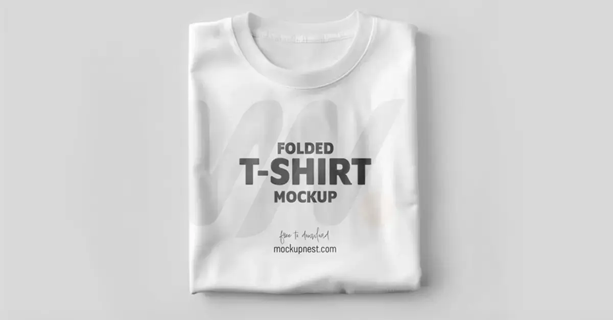 "Folded white t-shirt mockup with promotional text for free download.
