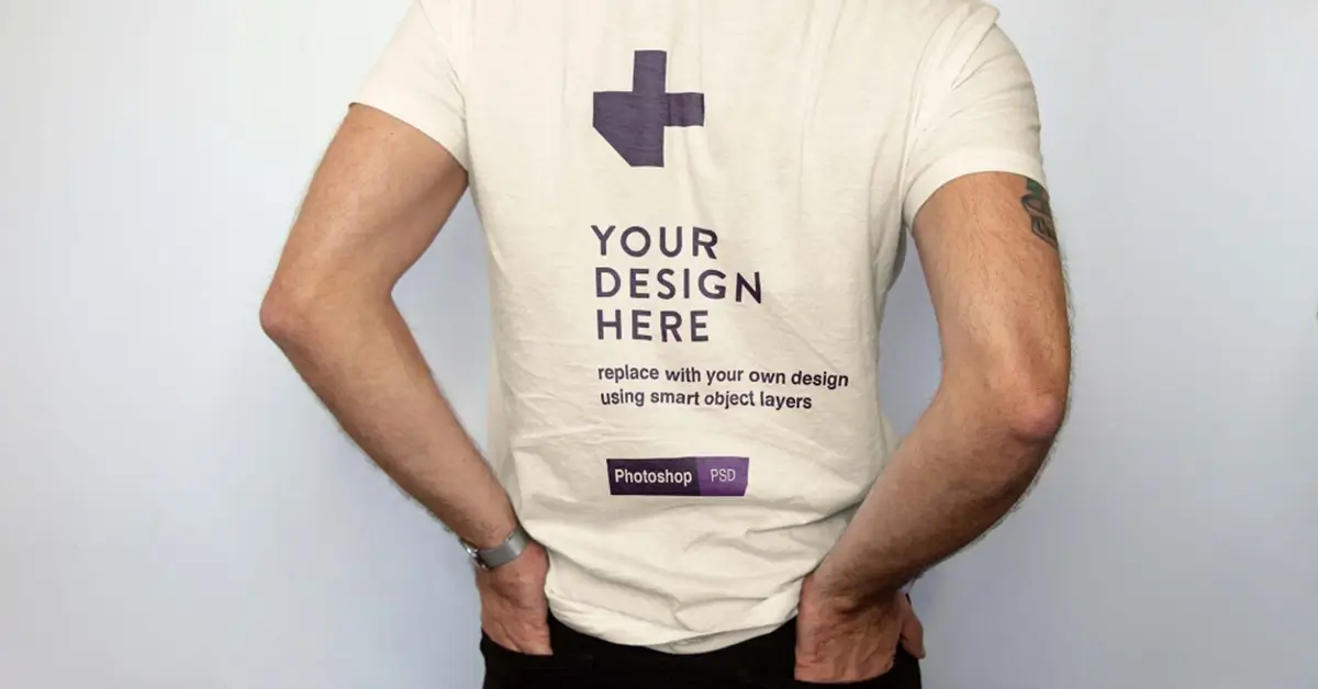 White t-shirt mockup with placeholder design and smart object instructions.