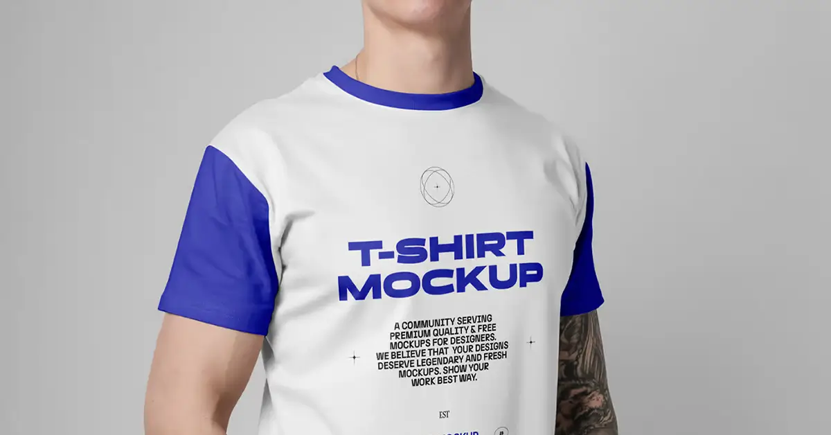 Person wearing white and blue t-shirt mockup with bold text and crown graphic.